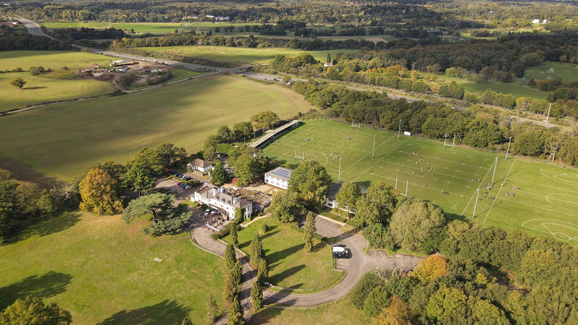 Elegant English countryside residential property surrounded by green lawns